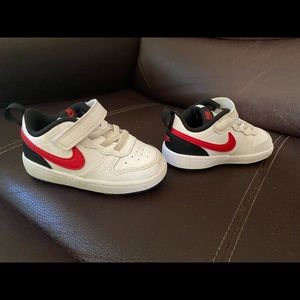 These shoes are Nike,their size is 7 in toddlers, their color is red and white.